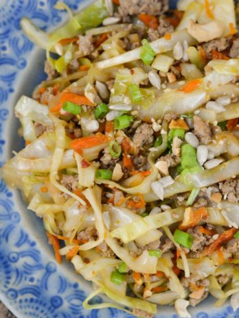 Egg Roll in a Bowl is an easy, healthy dinner that is ready in under 20 minutes! This easy pork stir fry recipe is loaded with meat, vegetables and a sesame sauce. 
