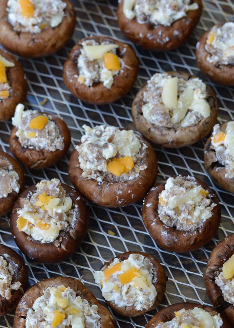 Stuffed Mushroom Appetizer This keto appetizer features healthy portobello mushrooms, which are stuffed with a mixture of savory Italian sausage, velvety cream cheese, sharp garlic and your favorite variety of cheese! There's only five ingredients in this recipe, but there is SO much flavor. This easy side dish is fantastic because it's ready in under 15 minutes, which is a huge plus when you're cooking for a crowd or on a weeknight!  Another reason I love this recipe is because it's super easy to prepare ahead of time and then either pop onto the grill or into the oven. So if you're expecting company the next day but you only have time to cook today, no problem! These stuffed mushrooms can easily be meal prepped in advance. It doesn't get much easier than that!