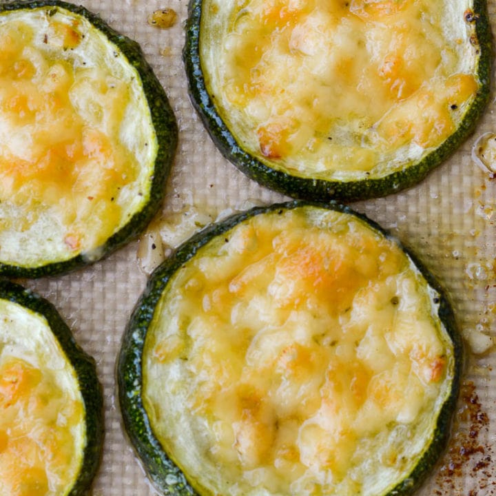 Closeup of roasted zucchini with parmesan on silpat