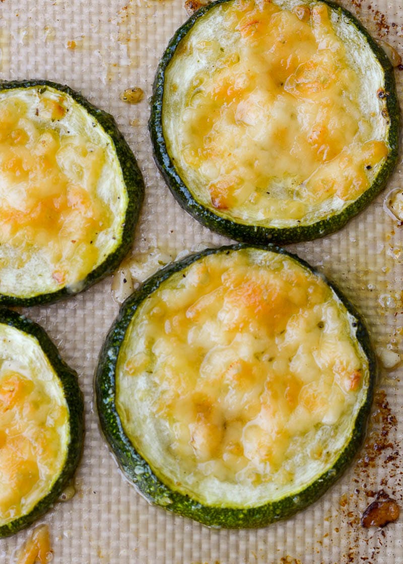 Closeup of roasted zucchini with parmesan on silpat