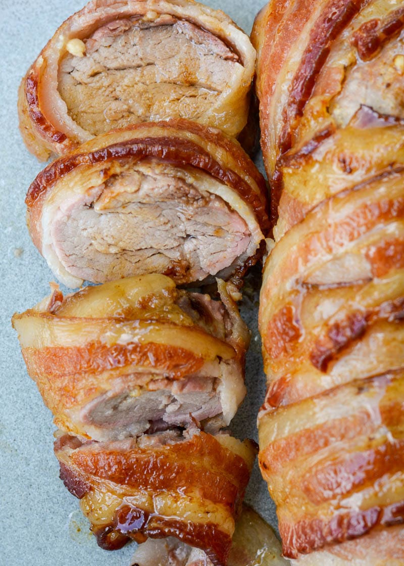 This Bacon Wrapped Pork Tenderloin is the juiciest, most flavorful dinner you can put on the table! This keto dinner has under 1 net carb per serving and is perfect for meal prepping.