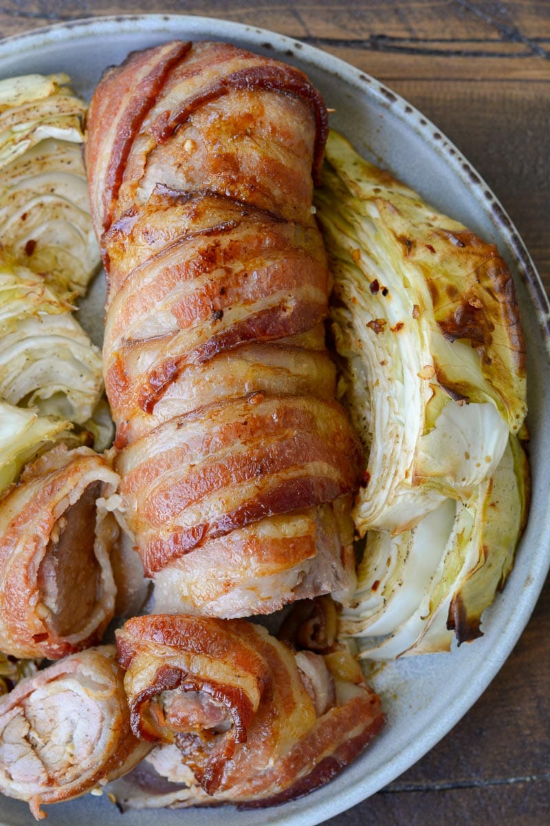 This Bacon Wrapped Pork Tenderloin is the juiciest, most flavorful dinner you can put on the table! This keto dinner has under 1 net carb per serving and is perfect for meal prepping.