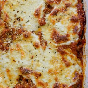 Cheesy Zucchini Casserole is the perfect five ingredient meal! This easy keto casserole is loaded with fresh zucchini, meat, marinara and cheese for about 2 net carbs per serving! 