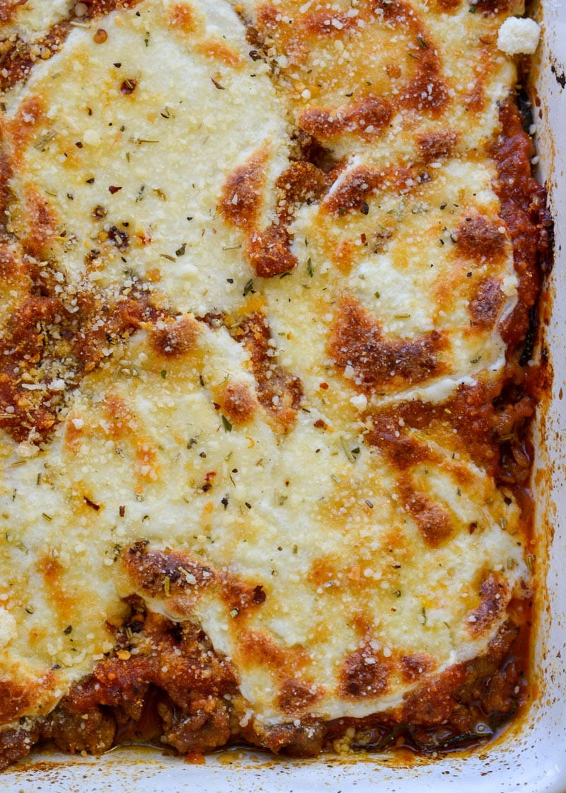Cheesy Zucchini Casserole is the perfect five ingredient meal! This easy keto casserole is loaded with fresh zucchini, meat, marinara and cheese for about 2 net carbs per serving! 