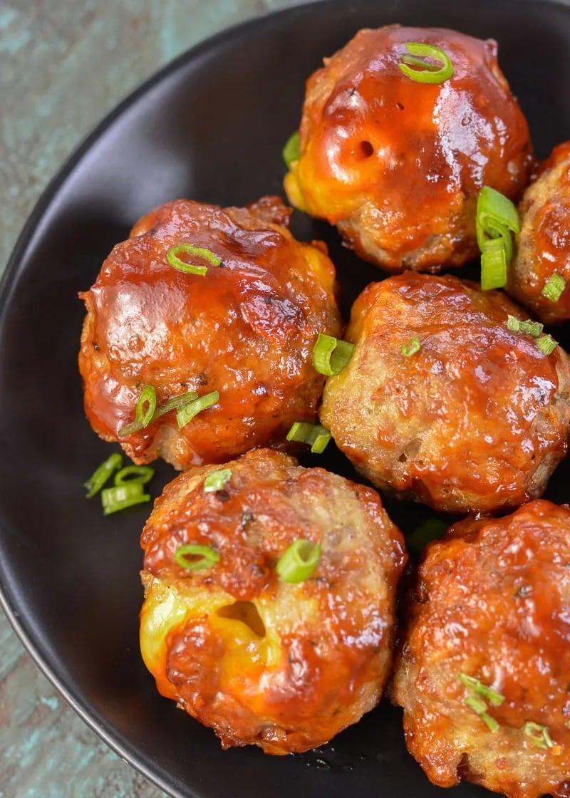BBQ Cheddar Meatballs are an easy dinner or appetizer! These cheesy delights can be made keto-friendly and cooked in the oven or air fryer!
