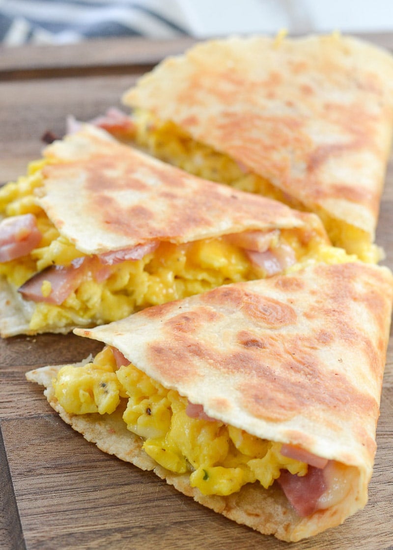 This Keto Breakfast Quesadilla is packed full with chunks of savory ham, fluffy scrambled eggs, and two types of cheese. Under 5 net carbs when made with low carb tortilla, too!