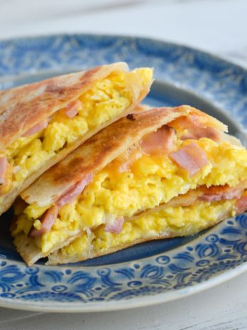 This Keto Breakfast Quesadilla is packed full with chunks of savory ham, fluffy scrambled eggs, and two types of cheese. Under 5 net carbs when made with low carb tortilla, too!