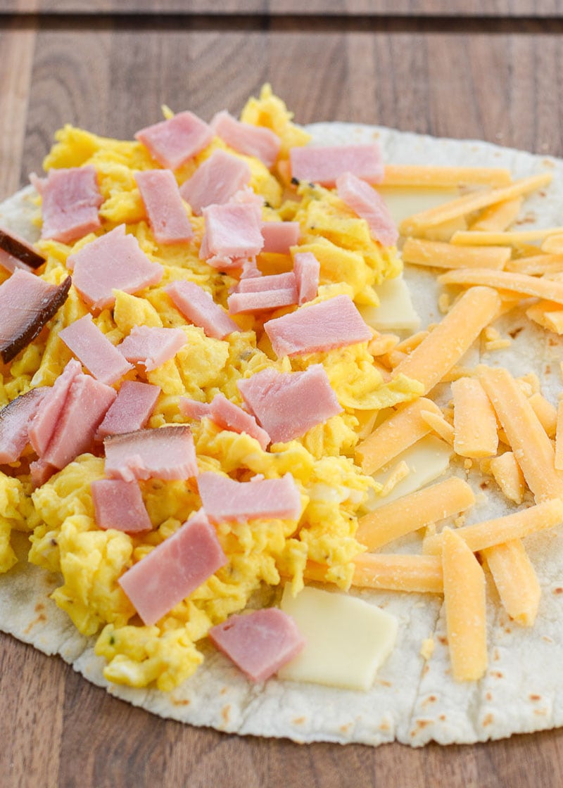 This Keto Breakfast Quesadilla is packed full with chunks of savory ham, fluffy scrambled eggs, and two types of cheese. Under 5 net carbs when made with low carb tortilla, too!