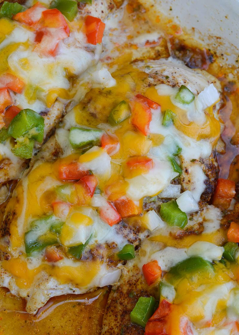 Seasoned chicken is smothered with peppers, onions and cheese in this easy Chicken Fajita Casserole! This keto meal is ready in 30 minutes and is under 4 net carbs!