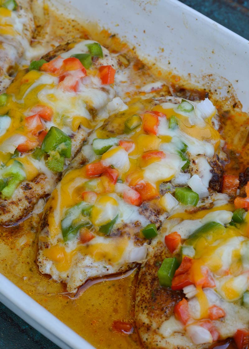 Seasoned chicken is smothered with peppers, onions and cheese in this easy Chicken Fajita Casserole! This keto meal is ready in 30 minutes and is under 4 net carbs!