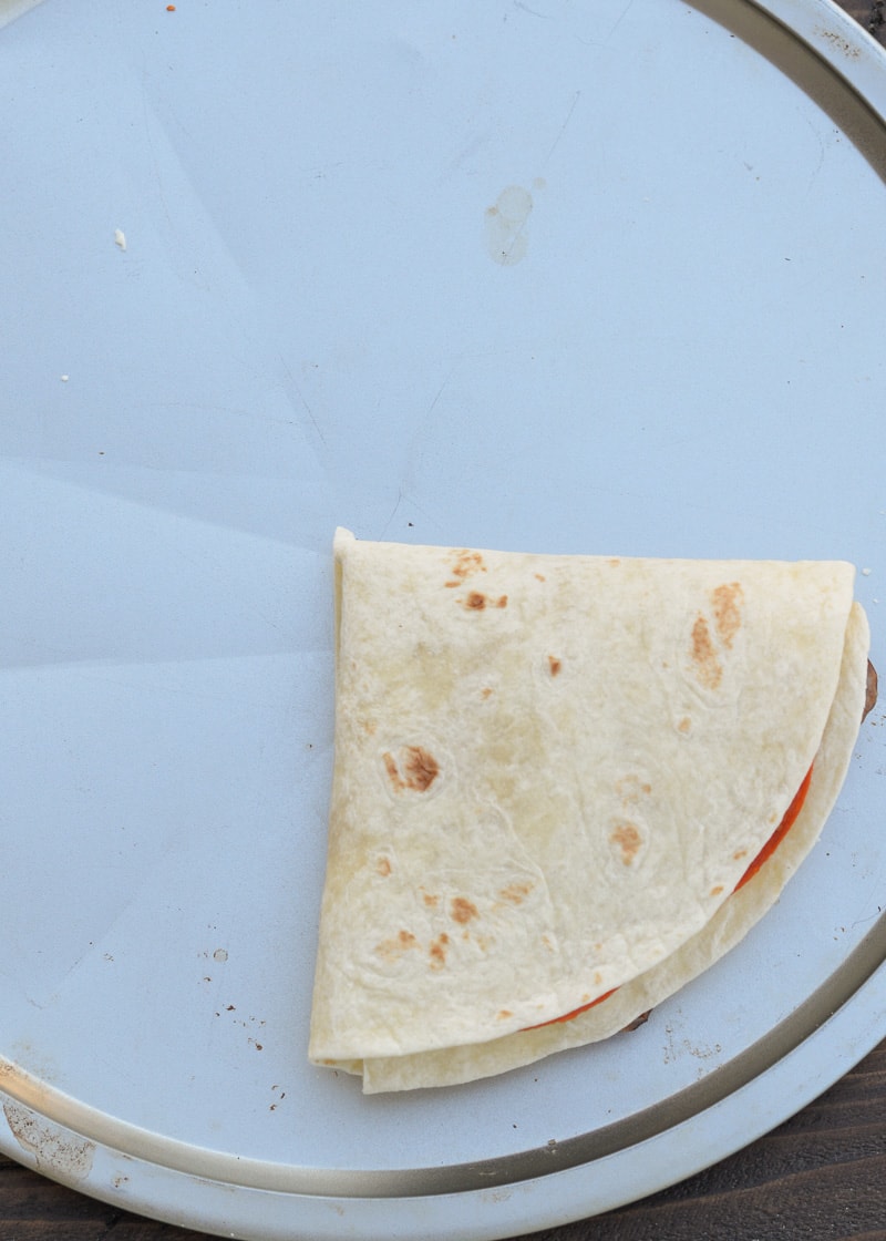 This Crispy Pizza Tortilla is an easy recipe you will love! It can be made low carb and gluten free for a delicious snack packed full of of meat and cheese!