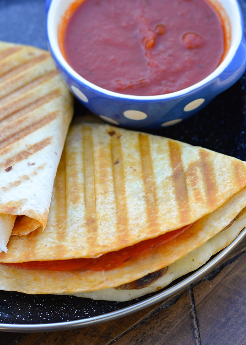 This Crispy Pizza Tortilla is an easy recipe you will love! It can be made low carb and gluten free for a delicious snack packed full of of meat and cheese!