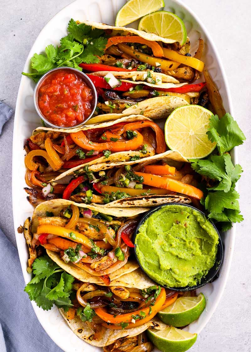 These Chicken Fajitas are packed with flavor for an easy, healthy meal! The chicken is flavored with a homemade marinade, then grilled to perfection.