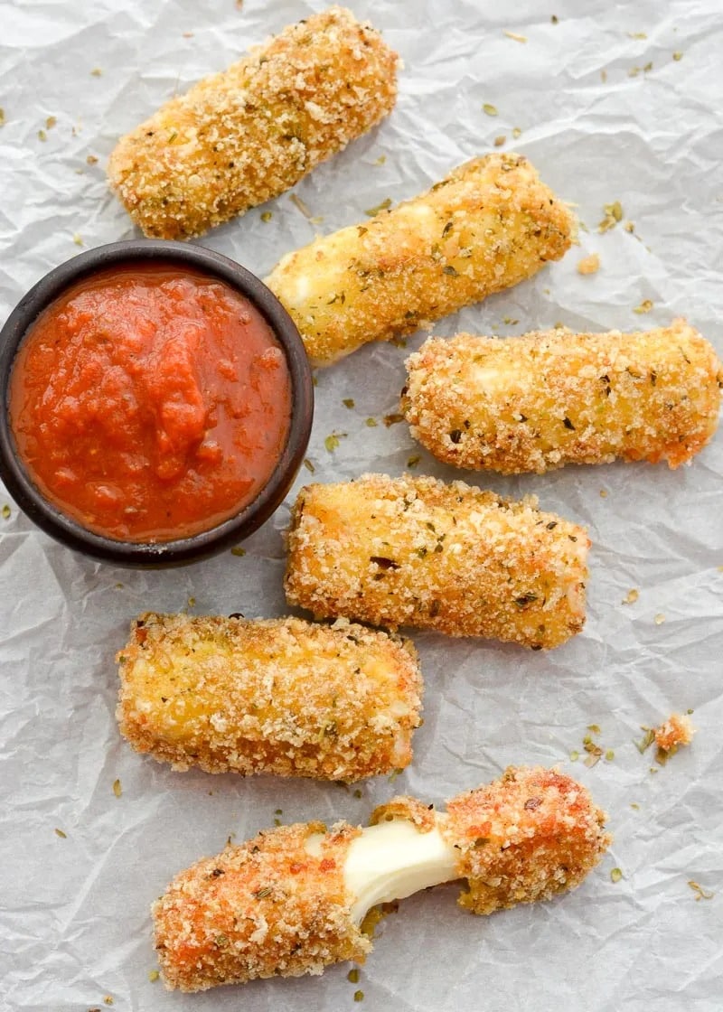These easy Keto Mozzarella Sticks are covered in an ultra crispy crust and fried to perfection! You can easily enjoy two mozzarella sticks for just 1.8 net carbs.