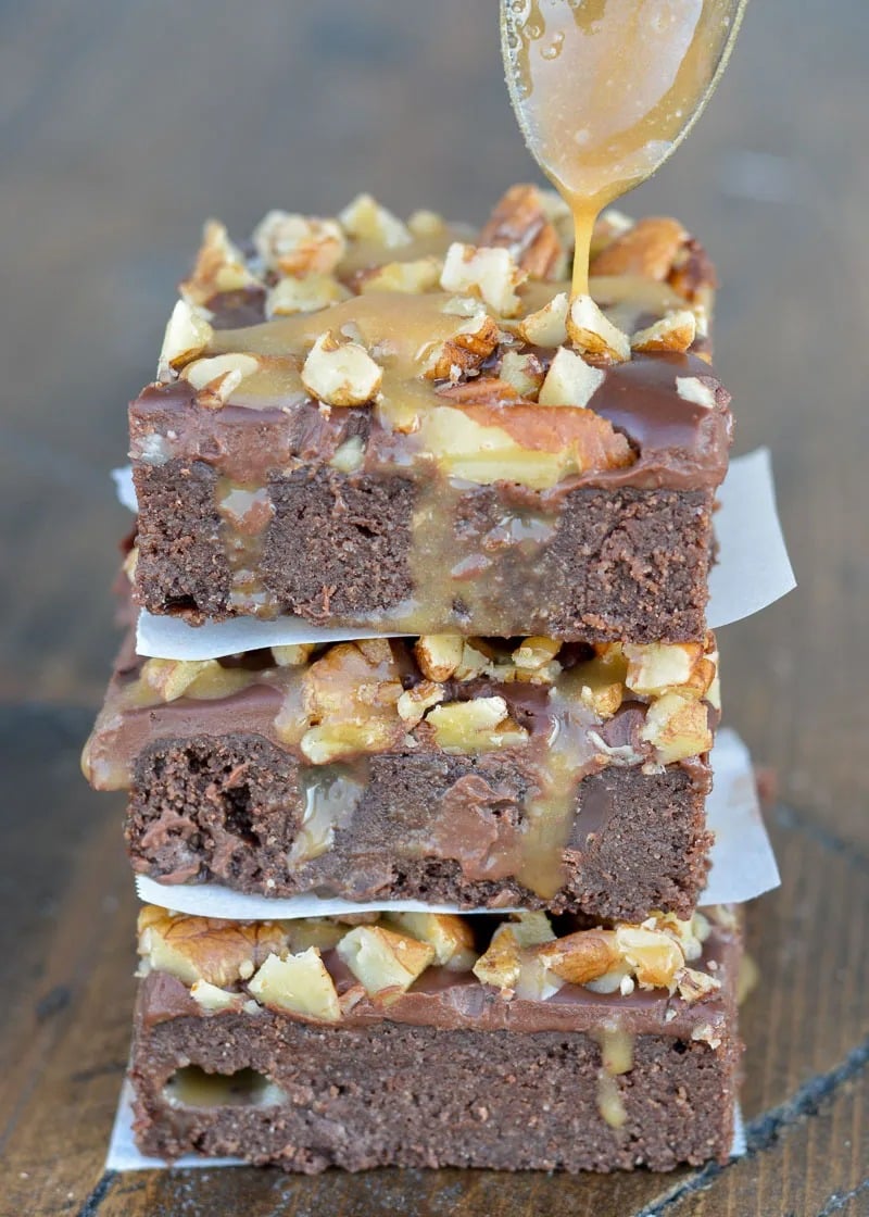 These delicious Turtle Brownies are perfectly fudgy and decadent. Gluten free brownies are covered with caramel, chocolate ganache, and roasted pecans for an amazing homemade dessert!