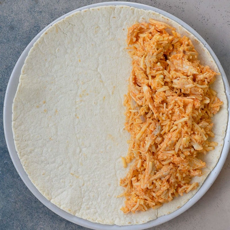 This Cheesy Buffalo Chicken Quesadilla is the ultimate weeknight dinner! Shredded chicken is combined with blue cheese, mozzarella and buffalo sauce and is cooked to perfection!