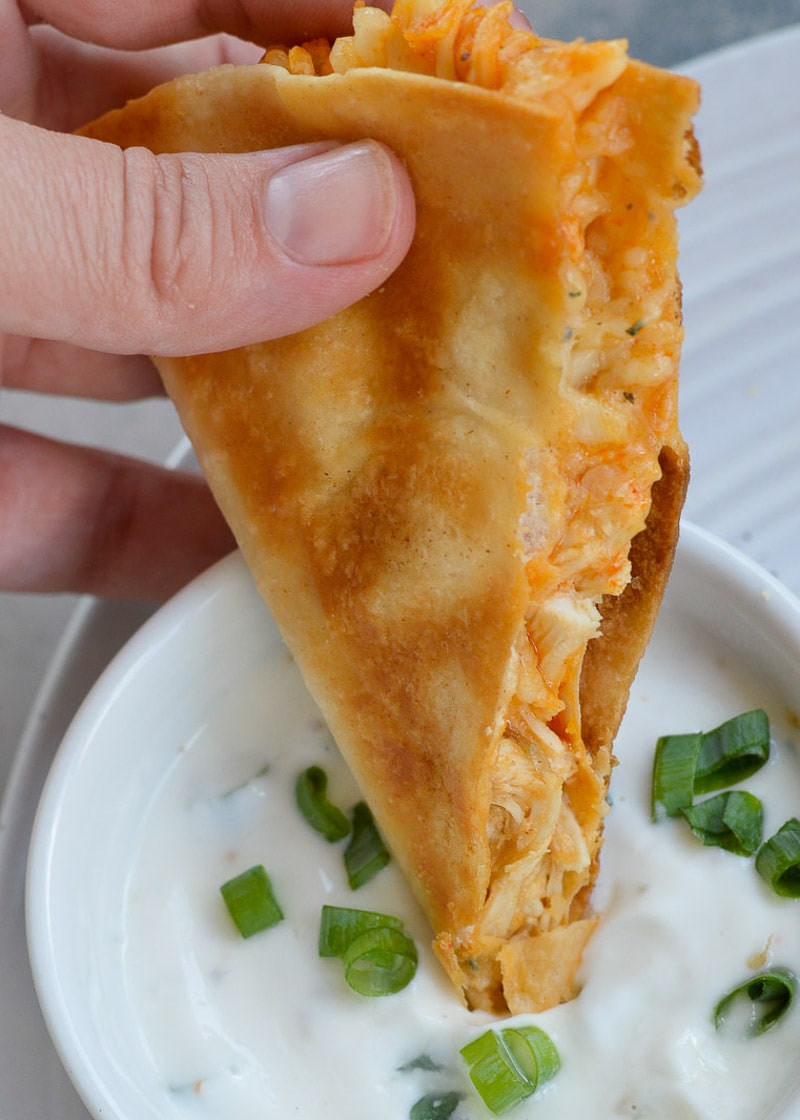 This Cheesy Buffalo Chicken Quesadilla is the ultimate weeknight dinner! Shredded chicken is combined with blue cheese, mozzarella and buffalo sauce and is cooked to perfection!