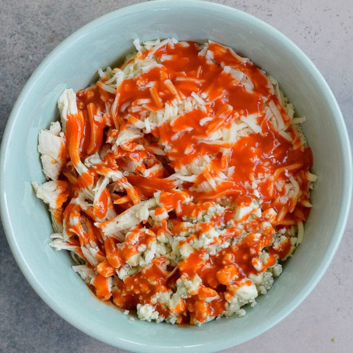 This Cheesy Buffalo Chicken Quesadilla is the ultimate weeknight dinner! Shredded chicken is combined with blue cheese, mozzarella and buffalo sauce and is cooked to perfection!