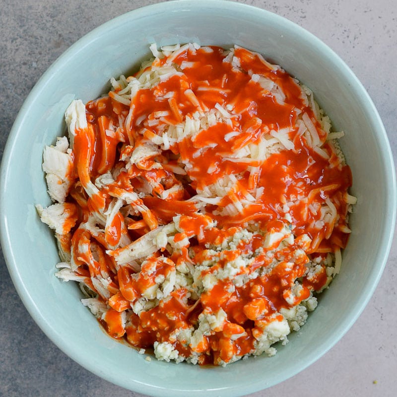 This Cheesy Buffalo Chicken Quesadilla is the ultimate weeknight dinner! Shredded chicken is combined with blue cheese, mozzarella and buffalo sauce and is cooked to perfection!