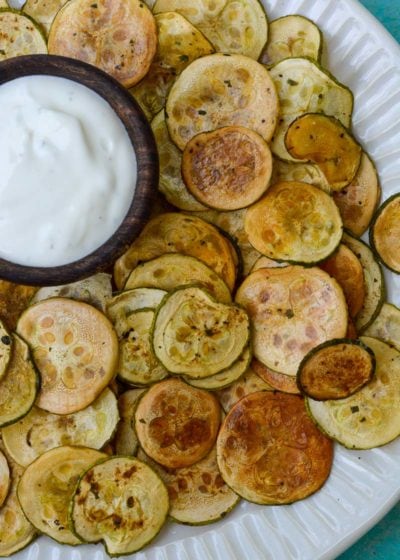 Crispy Zucchini Chips are the perfect healthy snack! Thinly sliced zucchini is roasted until it gives a satisfying crunch- you'll love this easy keto recipe!