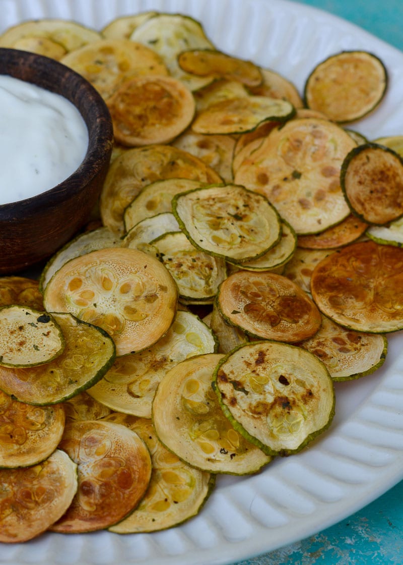 Crispy Zucchini Chips are the perfect healthy snack! Thinly sliced zucchini is roasted until it gives a satisfying crunch- you'll love this easy keto recipe!