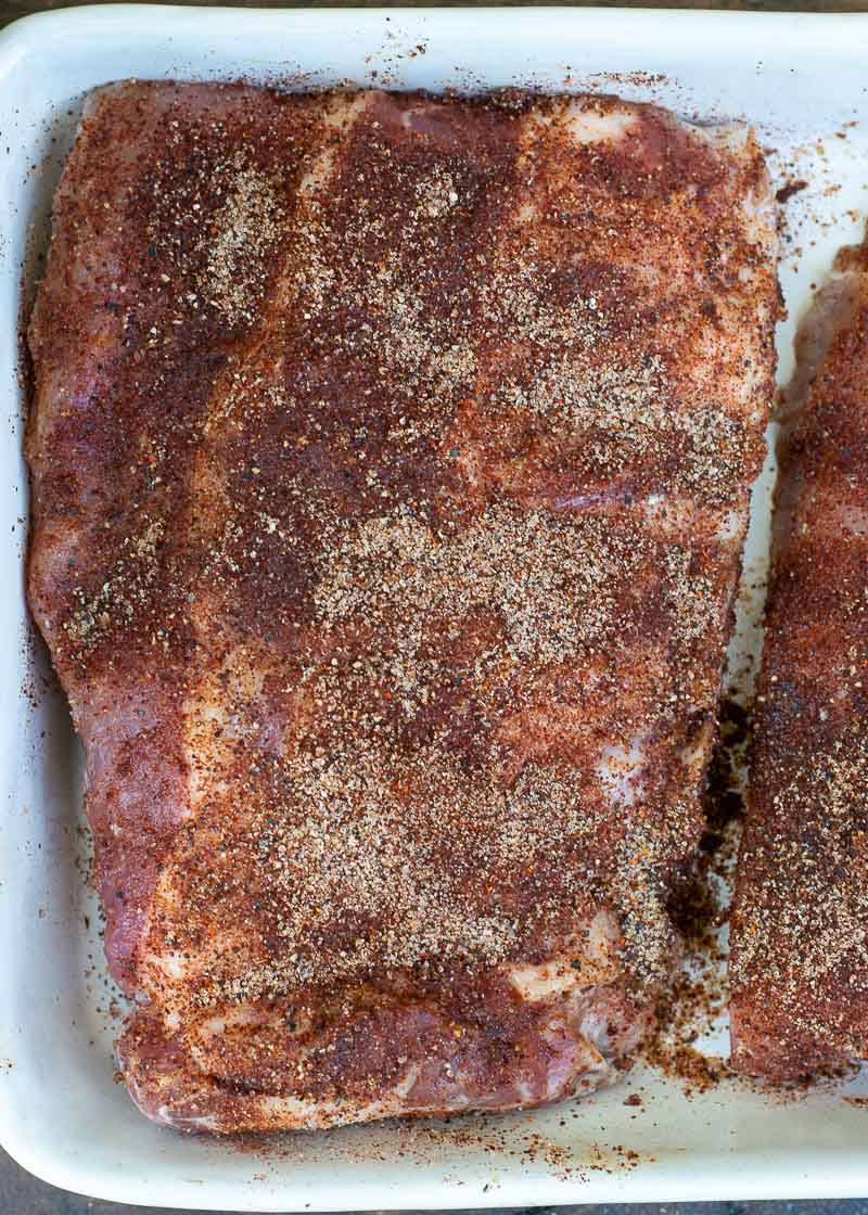 Try these ultra tender Crock Pot Ribs for the perfect easy meal! First ribs are seasoned with a smokey BBQ rub, cooked until super tender and then smothered in BBQ sauce and broiled to perfection! 