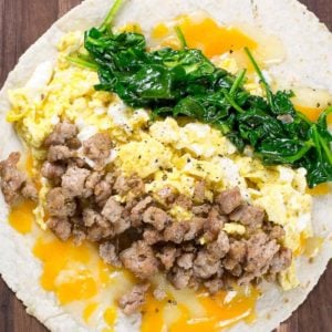 This Sausage Burrito is packed with sausage, eggs, cheese and spinach! This meal is super satisfying and is perfect for meal prep!