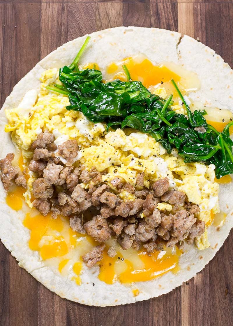 This Sausage Burrito is packed with sausage, eggs, cheese and spinach! This meal is super satisfying and is perfect for meal prep!