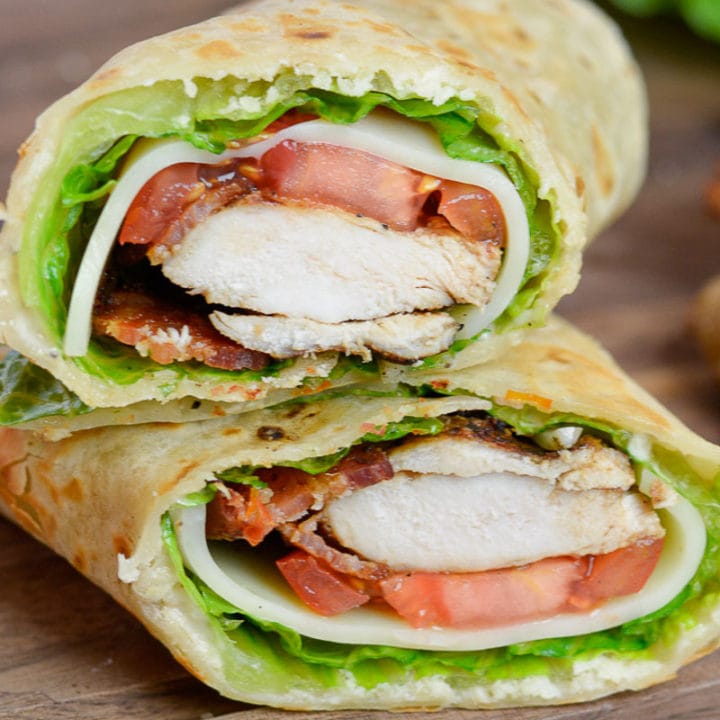 This Chicken Caesar Wrap is packed with juicy chicken, tangy Caesar dressing, tomatoes, lettuce, and two types of cheese. This healthy lunch recipe can be meal prepped and made low-carb, or gluten free, too!