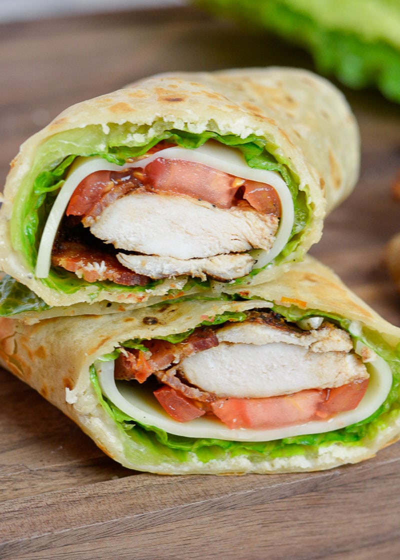 This Chicken Caesar Wrap is packed with juicy chicken, tangy Caesar dressing, tomatoes, lettuce, and two types of cheese. This healthy lunch recipe can be meal prepped and made low-carb, or gluten free, too!