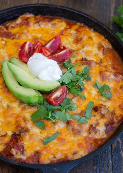 This one pan Chicken Enchilada Skillet is loaded with shredded chicken, tomatoes, green chilies and a creamy sauce! Enjoy a generous serving of this easy keto chicken recipe for under 5 net carbs!