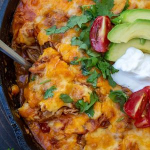 This one pan Chicken Enchilada Skillet is loaded with shredded chicken, tomatoes, green chilies and a creamy sauce! Enjoy a generous serving of this easy keto chicken recipe for under 5 net carbs!