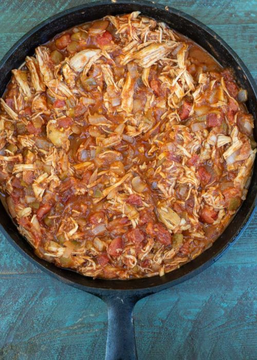 This one pan Chicken Enchilada Skillet is loaded with shredded chicken, tomatoes, green chilies and a creamy sauce! Enjoy a generous serving of this easy keto chicken recipe for under 5 net carbs!