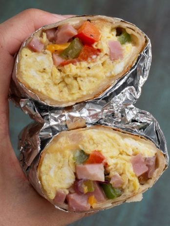 This Denver Omelette Breakfast Burrito is a delicious low carb breakfast! Fluffy eggs are combined with peppers, onions, ham and cheese, making a perfect meal prep recipe!