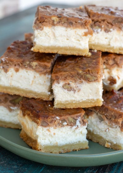 These Pecan Pie Cheesecake Bars feature a shortbread cookie crust, vanilla cheesecake and delicious pecan pie layer! This impressive dessert is keto-friendly and has just 5 net carbs per slice!