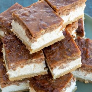 These Pecan Pie Cheesecake Bars feature a shortbread cookie crust, vanilla cheesecake and delicious pecan pie layer! This impressive dessert is keto-friendly and has just 5 net carbs per slice!