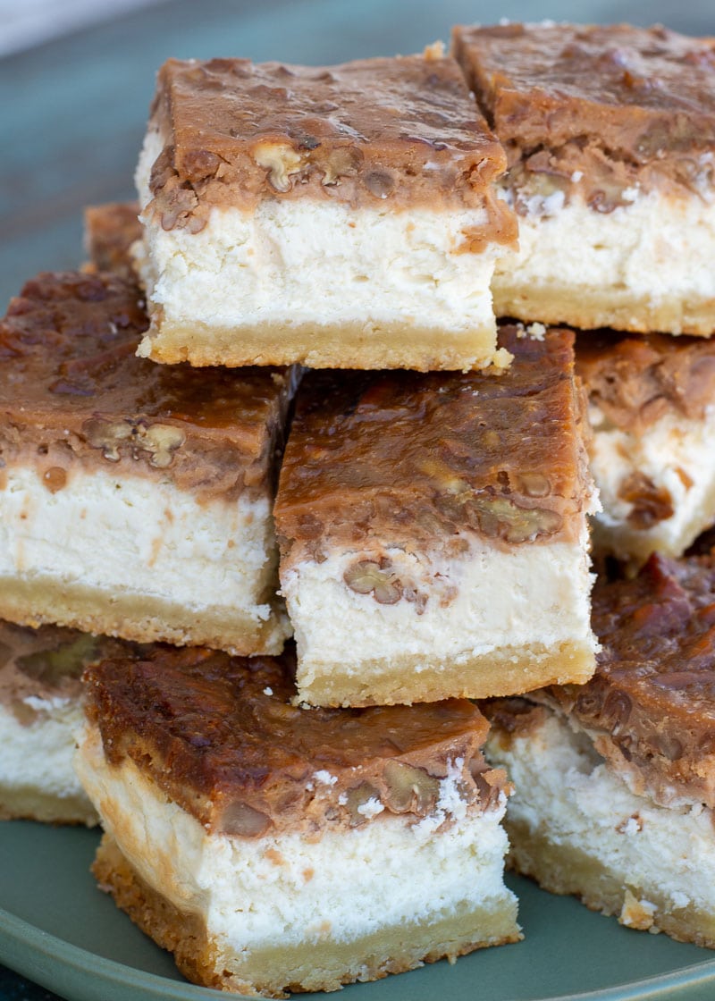 These Pecan Pie Cheesecake Bars feature a shortbread cookie crust, vanilla cheesecake and delicious pecan pie layer! This impressive dessert is keto-friendly and has just 5 net carbs per slice!