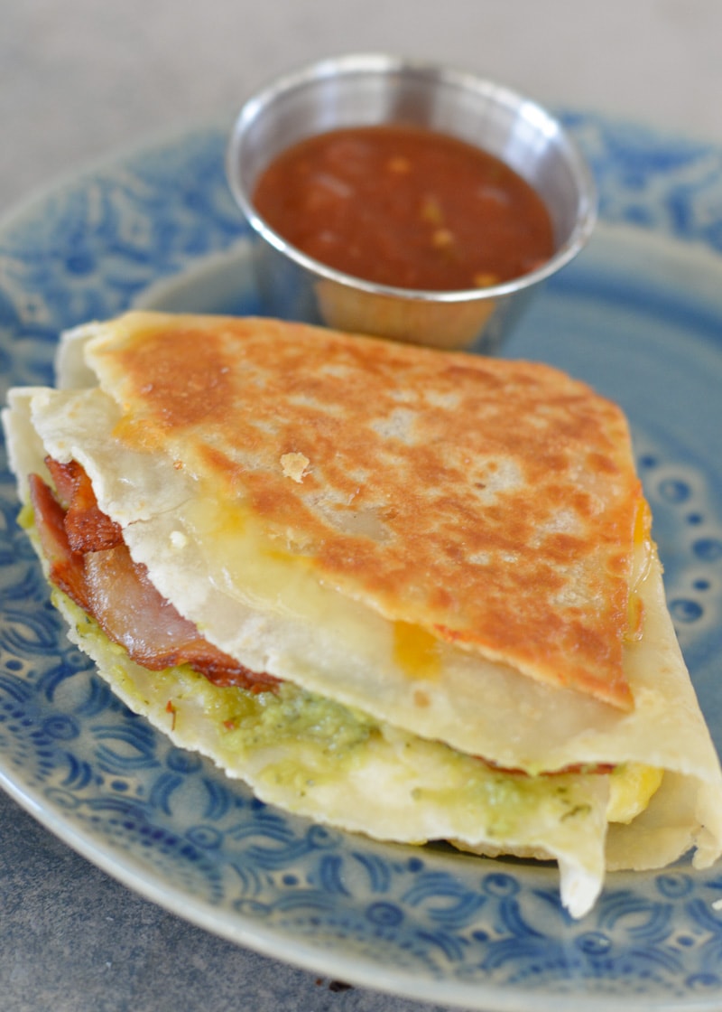 This Bacon Egg and Cheese Tortilla is the ultimate keto breakfast! Fluffy eggs, salty bacon, cheddar cheese and creamy avocado are all packed into a tortilla for a delicious, filling breakfast on the go!