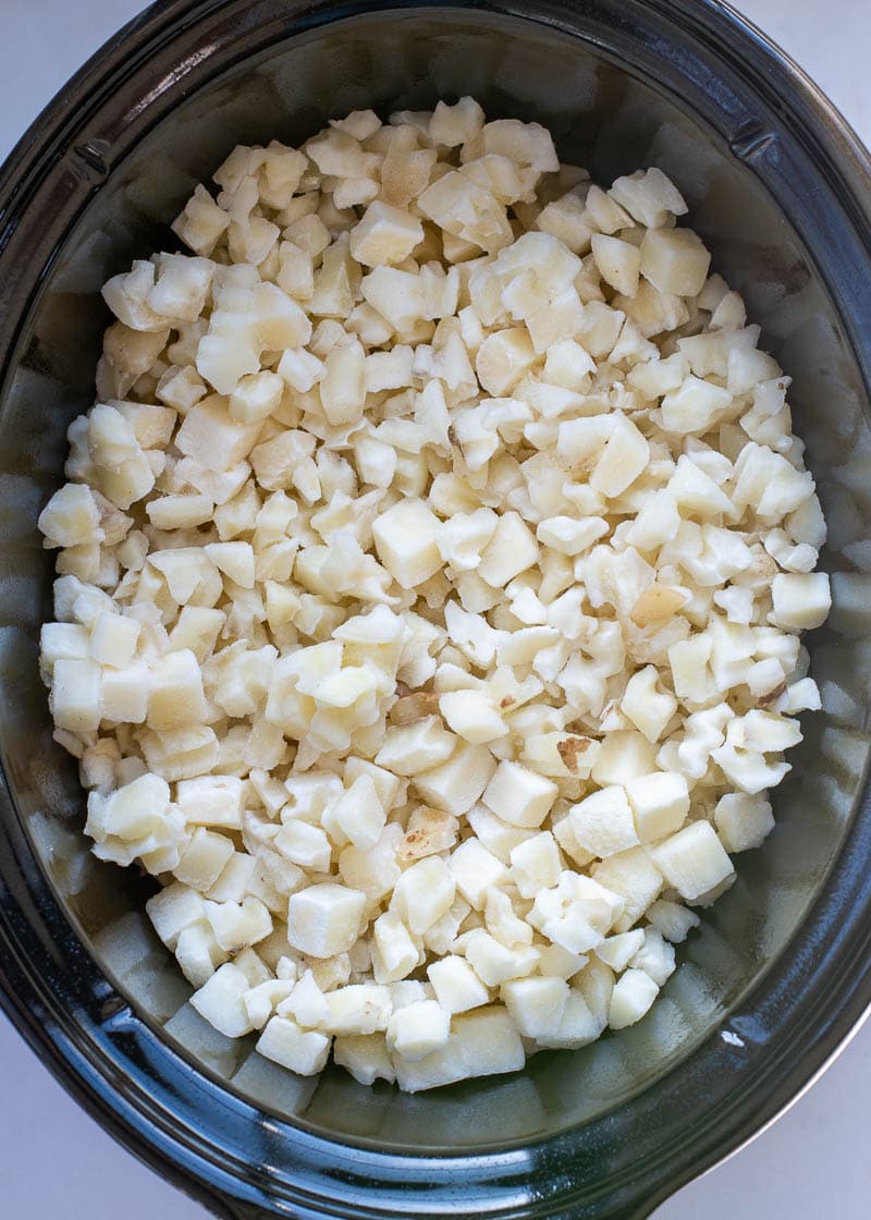 These Crockpot Cheesy Potatoes require a few basic ingredients and no prep! Simply dump the ingredients for these cheesy potatoes in a slow cooker, mix and forget it! This is the best side dish recipe!