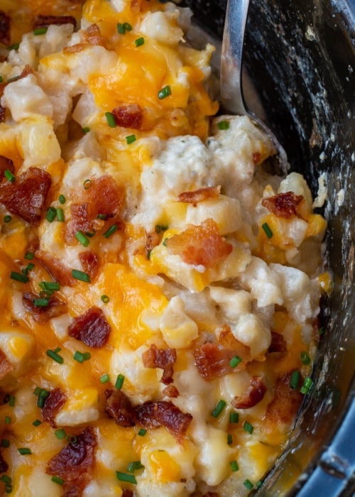 These Crockpot Cheesy Potatoes require a few basic ingredients and no prep! Simply dump the ingredients for these cheesy potatoes in a slow cooker, mix and forget it! This is the best side dish recipe!