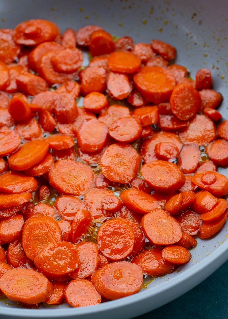 These easy Glazed Carrots require just 4 ingredients and are ready in about 15 minutes! This is the perfect holiday side dish that can be made ahead of time. 