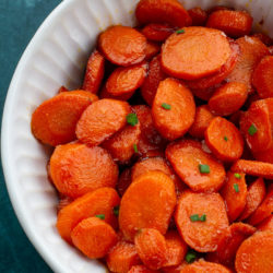 These easy Glazed Carrots require just 4 ingredients and are ready in about 15 minutes! This is the perfect holiday side dish that can be made ahead of time.