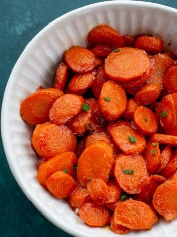 These easy Glazed Carrots require just 4 ingredients and are ready in about 15 minutes! This is the perfect holiday side dish that can be made ahead of time.