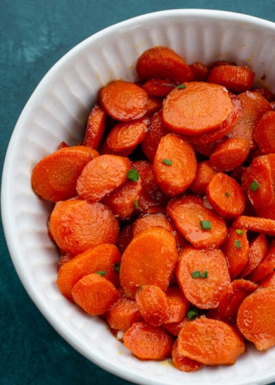 These easy Glazed Carrots require just 4 ingredients and are ready in about 15 minutes! This is the perfect holiday side dish that can be made ahead of time.