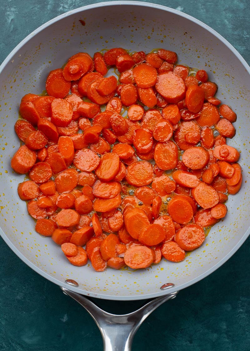 These easy Glazed Carrots require just 4 ingredients and are ready in about 15 minutes! This is the perfect holiday side dish that can be made ahead of time. 