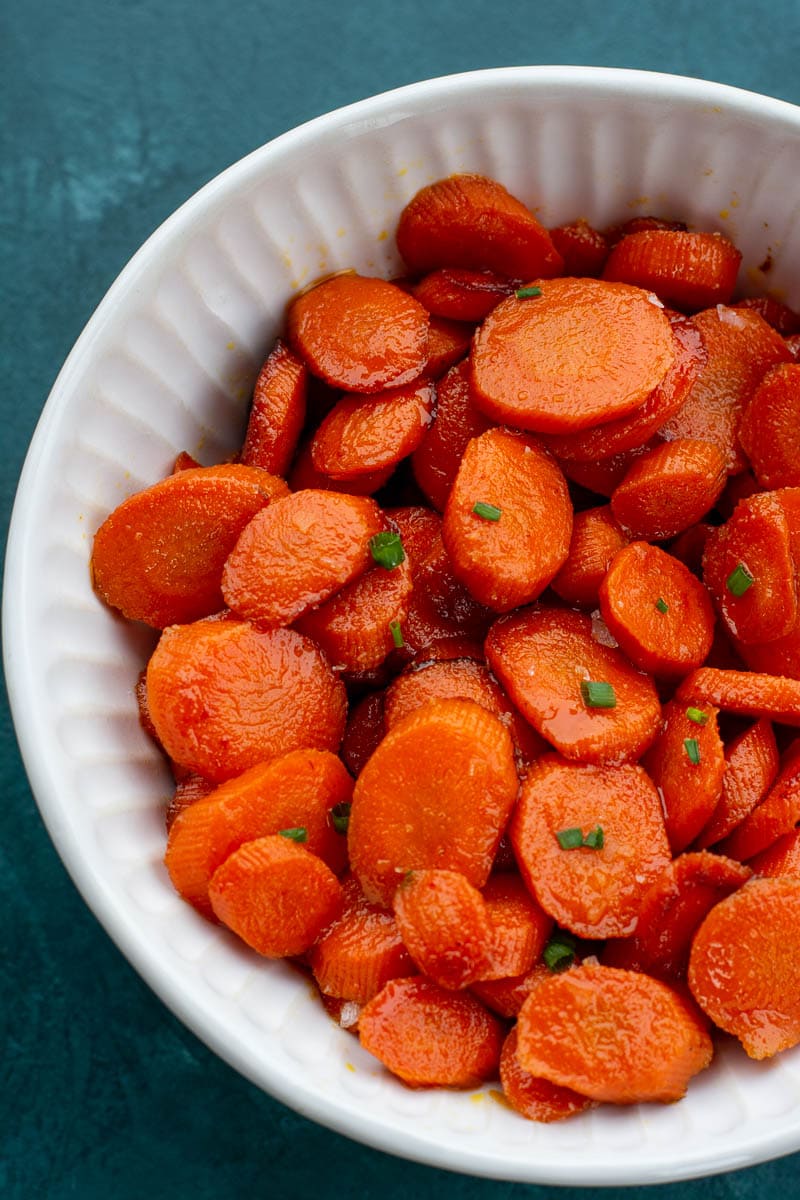 These easy Glazed Carrots require just 4 ingredients and are ready in about 15 minutes! This is the perfect holiday side dish that can be made ahead of time.