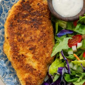 Crispy Parmesan Crusted Chicken is the perfect weeknight meal! This easy chicken recipe requires basic ingredients and is gluten free, low carb and keto-friendly!