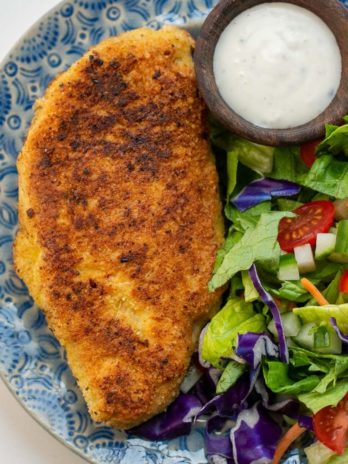 Crispy Parmesan Crusted Chicken is the perfect weeknight meal! This easy chicken recipe requires basic ingredients and is gluten free, low carb and keto-friendly!