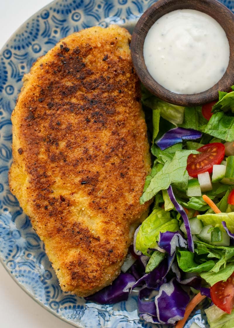 Crispy Parmesan Crusted Chicken is the perfect weeknight meal! This easy chicken recipe requires basic ingredients and is gluten free, low carb and keto-friendly!