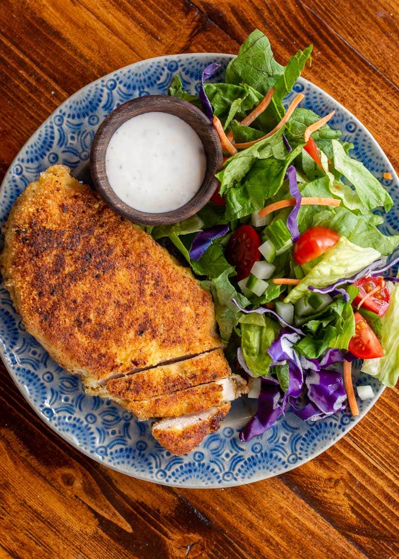 Crispy Parmesan Crusted Chicken is the perfect weeknight meal! This easy chicken recipe  requires basic ingredients and is gluten free, low carb and keto-friendly! 